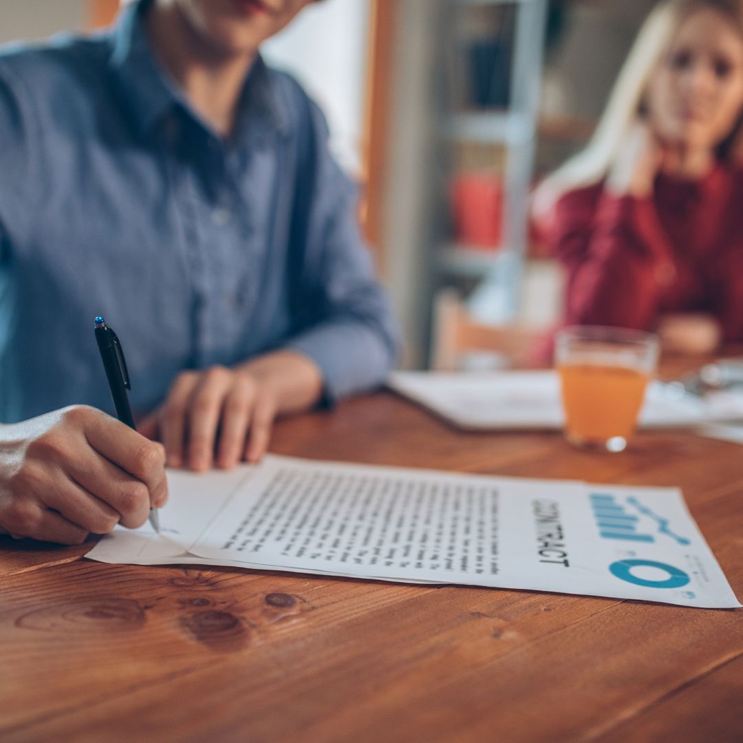 A couple signing a contract for a container