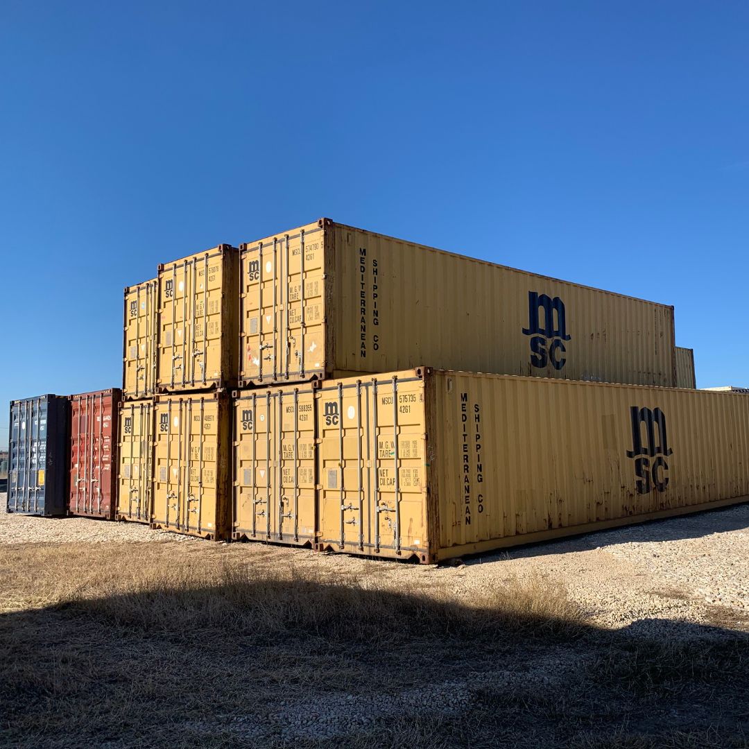a large stack of shipping containers