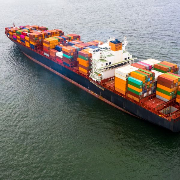 stacked shipping boxes on a boat