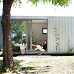 Women inside her container office