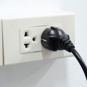 Wire plugged into wall outlet
