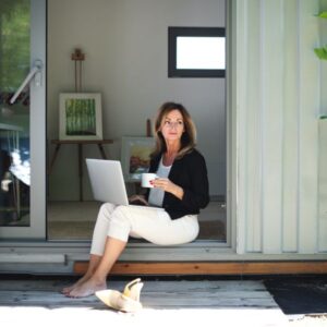 Women on laptop within her container office