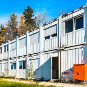 Lots of shipping containers stacked on top of one another
