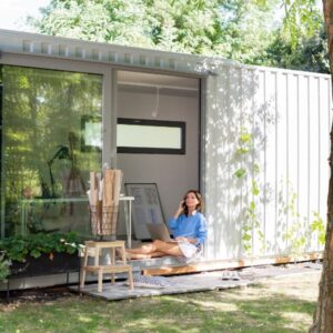 Women inside her container office