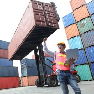 man directing shipping container