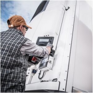 man checking temperature of storage container