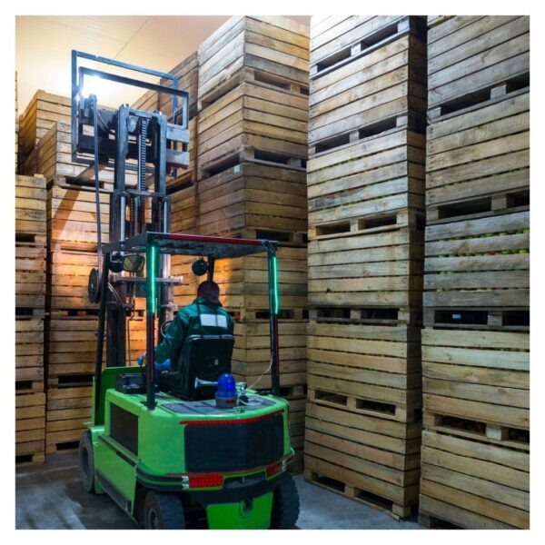 lift lifting pallet of wood crates onto bigger stack