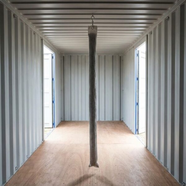 a container with a moisture-absorbing pole hanging from the ceiling